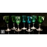 A small group of seven assorted 19th Century drinking glasses, each with green bowls above a plain