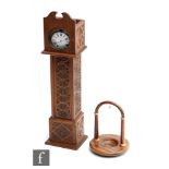 A late 19th Century carved wooden pocket watch stand modelled as longcase clock case with
