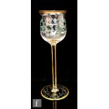 An early 20th Century Meyr's Neffe wine glass, circa 1900, the ogee bowl intaglio cut and