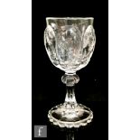 A later 19th Century Thomas Webb & Sons Rock Crystal style wine glass, of lobed ovoid form