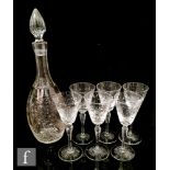 An early 20th Century Stevens & Williams clear crystal decanter of ovoid form with tall fluted