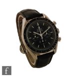 A gentleman's Omega Speedmaster Professional wrist watch, three subsidiary dials to a black dial,