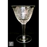 A later 19th Century Stourbridge rock crystal style drinking glass, the round funnel bowl