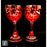 A pair of later 19th Century Stourbridge wine glasses, circa 1890, possibly marriage goblets, the