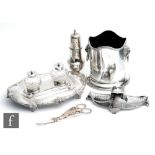 A silver plated twin well desk stand with acanthus leaf details with a WMF ink well ice bucket,