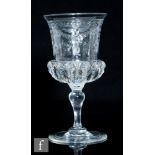 An early 20th Century Thomas Webb & Sons wine glass with a heavily cut thistle bowl decorated with