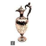 A 19th Century silver plated ewer claret jug decorated with engraved study of Venus, Neptune and