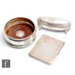 Three hallmarked silver items to include a bottle coaster, an engine turned cigarette case with gold