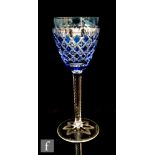 A 20th Century Stevens & Williams hock drinking glass, the round funnel bowl cased in blue over