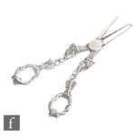 A pair of hallmarked silver grape scissors decorated with fruiting vine naturalistic handles, weight