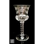A 20th Century Thomas Webb & Sons wine glass, the moulded thistle bowl with polished intaglio