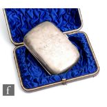 A cased hallmarked silver cushioned rectangular cigar case of plain form with presentation engraving