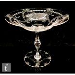 A 20th Century Thomas Webb & Sons tazza, the clear crystal shallow circular bowl intaglio cut with