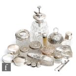 A small parcel lot of assorted white metal, hallmarked and sterling silver topped scent bottles,