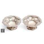 A pair of hallmarked silver circular pedestal bon bon dishes, each with pierced decoration and