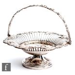 A 19th Century silver plated circular swing basket with part wire work and fruiting vine