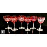 A small group of six 19th Century and later cranberry drinking glasses all of ovoid bowl form, to
