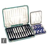 A cased set of Art Deco hallmarked silver handled fruit knives and forks, with a further eight