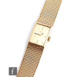 A lady's 9ct hallmarked Omega wrist watch, batons to a rectangular champagne dial weight 15mm, to an