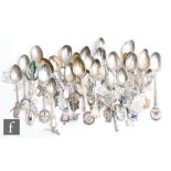 A parcel lot of assorted silver and white metal souvenir tea spoons relating to Australia, New