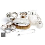 A small parcel lot of assorted hallmarked silver items to include a silver topped glass scent