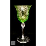 An early 20th Century Stevens & Williams wine glass, circa 1900, the bell bowl cased in green over