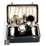 A cased hallmarked silver three piece cruet set, Sheffield 1938, with three further condiments and