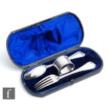 A cased composed hallmarked silver christening set comprising spoon, fork and napkin ring,