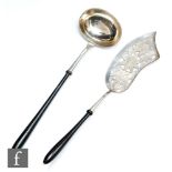 A 19th Century continental silver ladle with turned ebony handle with a similar fish slice with