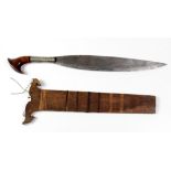 An early 19th Century shaped heavy steel Middle Eastern Short Sword, with silver and shaped wooden