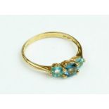 An attractive three stone aquamarine Ladies Ring Set, in gold  band, set with large central stone