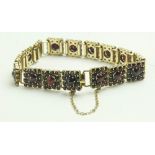 A Ladies gold plated silver Bracelet, of link design with attractive ruby type pyramid shaped garnet
