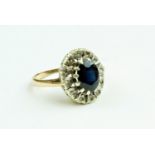 An attractive Ladies oval shaped Ring, with large centre sapphire surrounded by small inset