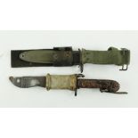 A U.S. Marine Issue Bayonet / Dagger, with black handle and green coloured scabbard; together with a