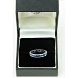 A Channel Set platinum Eternity sapphire Ring, set with .06 x 25 = 1.5 tcw, size J. (1)