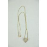 An attractive 10ct gold Chain, with decorative heart shaped pendant set with three central