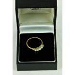 An 18ct gold Ring, with five graduating pearls, set with .1ct of diamond chips, size L 1/2. (1)