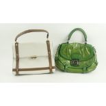 A green leather Handbag, by Celine bearing logo "Celine," on interior, with chrome metalware and