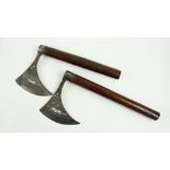 A pair of Persian 19th Century steel engraved Battle Axes, decorated in the typical taste with