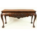 A good quality 19th Century Irish mahogany Side Table, the plain top with gadroon edge over a shaped