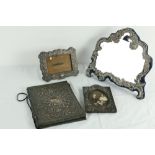 An Edwardian silver cartouche shaped Table Mirror, by William Comyns London 1902, 12" x 13" (30cms x