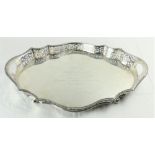 A very fine large heavy serpentine shaped oval silver Tray, Sheffield 1924, by Walker & Hall with