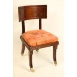 A late Regency period mahogany "Klismos" Side Chair, probably Irish, with deep curved panel back