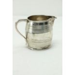 A late George III Scottish silver Cream Jug, Edinburgh 1814, the barrel shaped body with a shaped