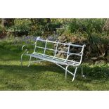 A pair of attractive Victorian metal strapwork Garden Benches, with latted seats and scroll legs,