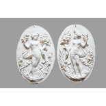 A pair of oval plaster Wall Reliefs, with classical Woman, 38cms (15") high. (2)
