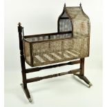 A good 19th Century Gothic style mahogany Child's Rocking Cradle, with caned panels under an