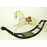 A good old Edwardian black and white painted wooden Rocking Horse, with leather saddle, 211cms (83")