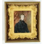 19th Century Irish SchoolHalf length Miniature Portrait of a Young Gentleman wearing a dark blue
