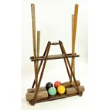 The 'Ilsborne' Croquet Carrier Stand, made by F.H. Ayres of London, with four mallets and four